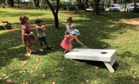 Children playing on green grass in Kenya. Child participation leads to a more humane society, says Gerison Lansdown. Photo: SMC. Kenya.
