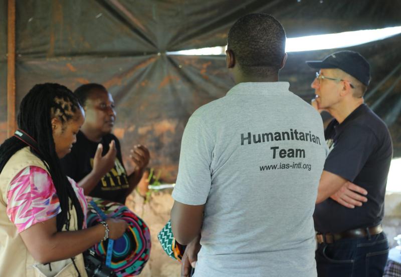 Humanitrian workshop discussion, Kenya. A group conversation between four people during a humanitarian workshop in Kenya.